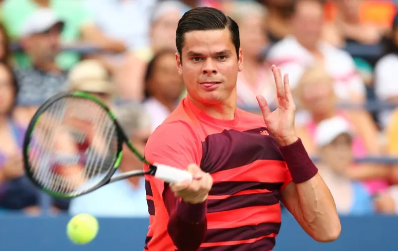 NEW YORK, NY - SEPTEMBER 04: Milos Raonic of Canada returns a shot against Feliciano Lopez of Spain during their Men's Singles Third Round match on Day Five of the 2015 US Open at the USTA Billie Jean King National Tennis Center on September 4, 2015 in the Flushing neighborhood of the Queens borough of New York City.   Elsa/Getty Images/AFP