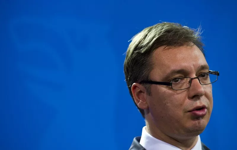 Serbian Prime Minister Aleksandar Vucic address a joint press conference following talks with German Chancellor at the chancellery in Berlin June 11, 2014. AFP PHOTO / JOHN MACDOUGALL