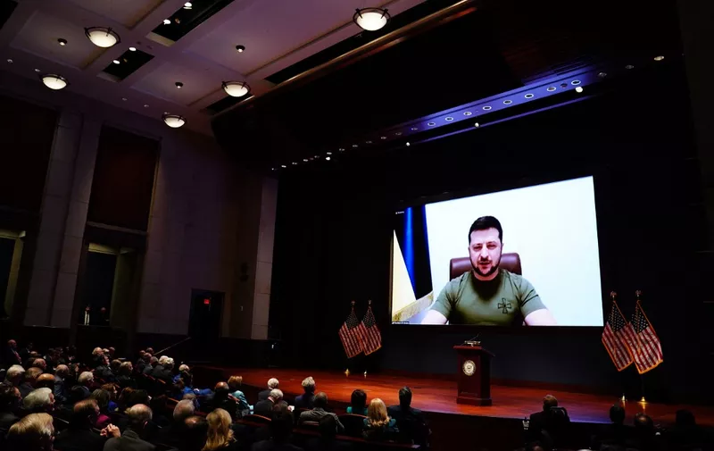 Ukrainian President Volodymyr Zelensky virtually addresses the US Congress on March 16, 2022, at the US Capitol Visitor Center Congressional Auditorium, in Washington, DC. (Photo by SARAH SILBIGER / POOL / AFP)