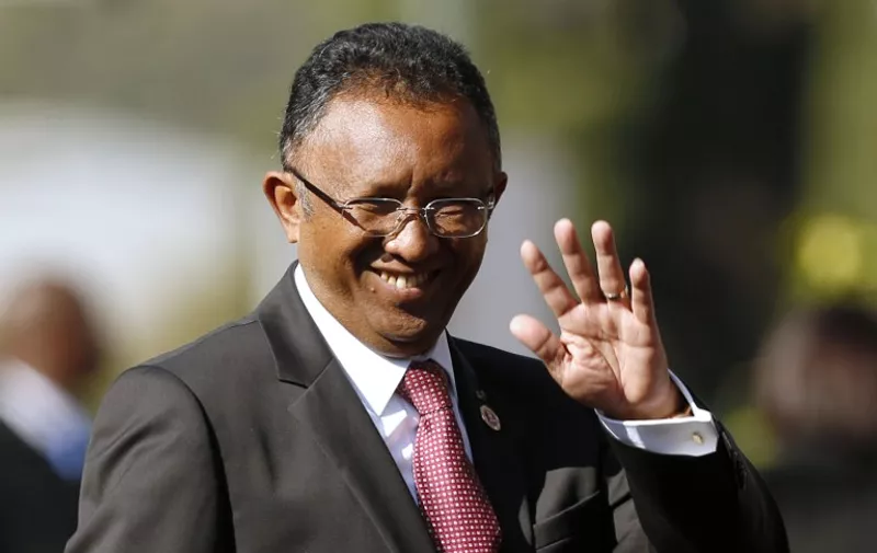 (FILES)-- A file photo taken on May 24, 2014 shows President of Madagascar Hery Rajaonarimampianina arriving for the inauguration ceremony of the South African president in his final term at the Union Buildings in Pretoria. The High Constitutional Court of Madagascar on June 13, 2015 rejected as "unfounded" the impeachment request of President of Madagascar Hery Rajaonarimampianina passed by the National Assembly on May 26, 2015. AFP PHOTO / POOL / SIPHIWE SIBEKO