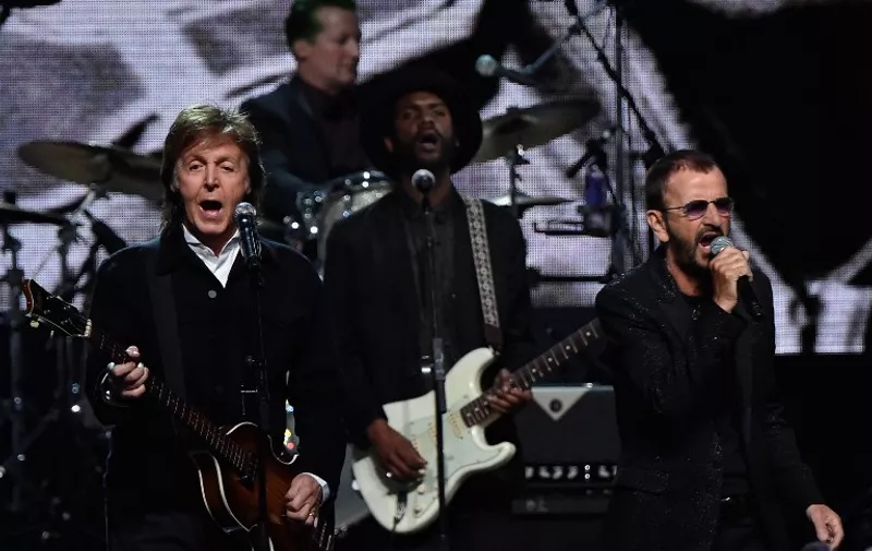 CLEVELAND, OH &#8211; APRIL 18: Sir Paul McCartney (L) and inductee Ringo Starr perform onstage during the 30th Annual Rock And Roll Hall Of Fame Induction Ceremony at Public Hall on April 18, 2015 in Cleveland, Ohio. Mike Coppola/Getty Images/AFP