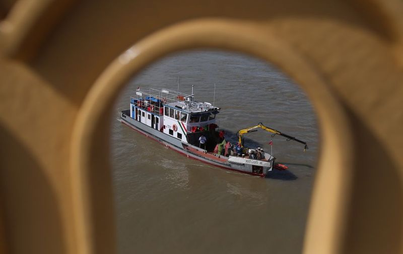 BUDAPEST, HUNGARY - MAY 31: Authorities prepare to recover a tourist boat that capsized on May 29, killing at least seven people, on May 31, 2019 in Budapest, Hungary. The boat, called the "Mermaid," sunk after colliding with a larger tour boat, the Viking Sigyn. Most of the passengers on the sunken vessel were tourists from South Korea, whose foreign ministry says that 19 of its citizens are still missing following the incident. (Photo by David Balogh/Getty Images)