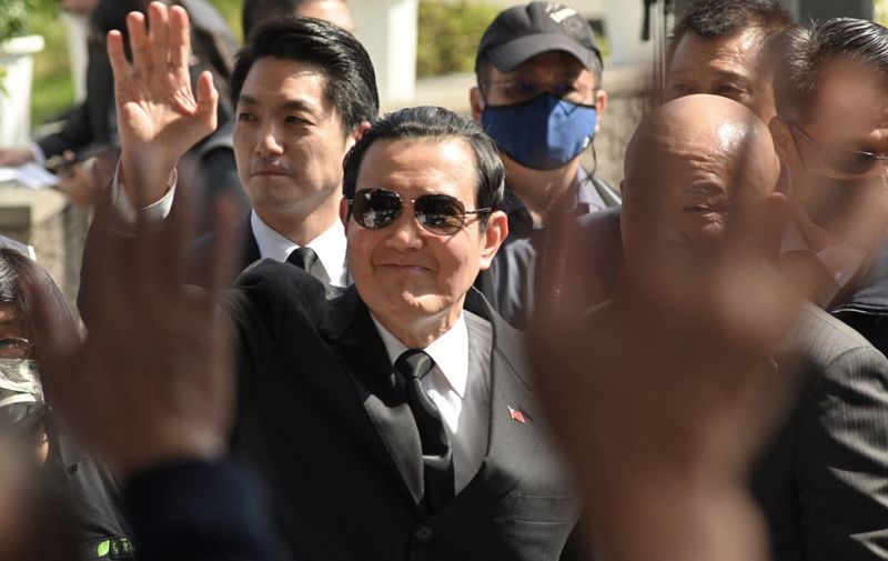 Former president Ma Ying-Jeou (C) waves to relatives as Taipei Mayor Chiang Wan-an (L) follows during a ceremony marking the 76th anniversary of "228 incident" at the 228 Peace Park in Taipei on February 28, 2023. - The "228 incident", which took place on February 28, 1947, led to the massacre of thousands of people as security forces violently quashed an anti-government uprising. (Photo by Sam Yeh / AFP)