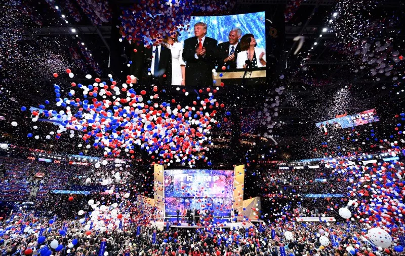 Ballons fall after Republican presidential candidate Donald Trump spoke and accepted the party nomination on the last day of the Republican National Convention on July 21, 2016, in Cleveland, Ohio. / AFP PHOTO / Jim Watson