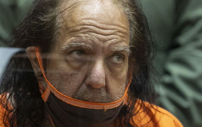 Adult film actor Ron Jeremy appears for his arraignment on rape and sexual assault charges at Clara Shortridge Foltz Criminal Justice Center on June 26, 2020 in Los Angeles, California. - Jeremy, whose real name is Ronald Jeremy Hyatt, is charged with raping three women and sexually assaulting another in separate incidents dating back to 2014. The 67-year-old defendant could face up to 90 years to life in state prison if convicted as charged. (Photo by David McNew / POOL / AFP)