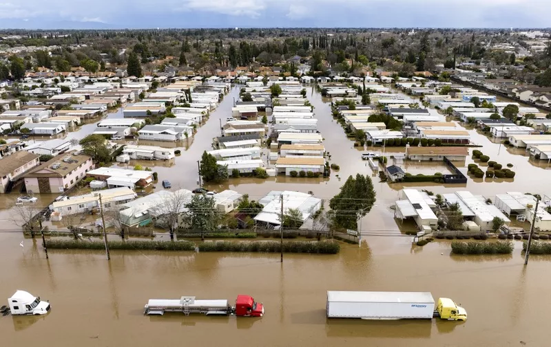 This aerial view shows a flooded neighborhood in Merced, California on January 10, 2023. - A massive storm called a bomb cyclone" by meteorologists has arrived and is expected to cause widespread flooding throughout the state. (Photo by JOSH EDELSON / AFP)