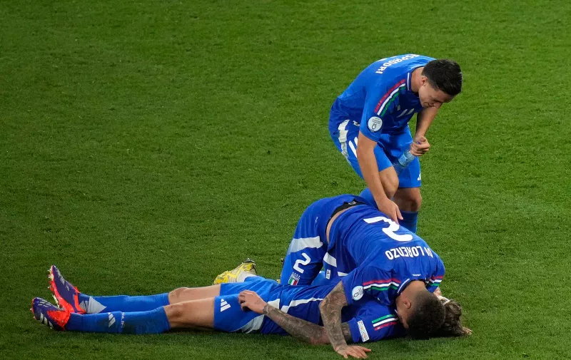 Italy's Giovanni Di Lorenzo celebrates after the Group B match between Croatia and Italy at the Euro 2024 soccer tournament in Leipzig, Germany, Monday, June 24, 2024. The match ended in a 1-1 draw. (AP Photo/Sergei Grits)