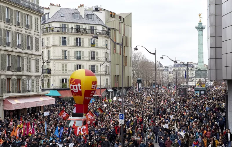Protestors gathered for a demonstration, as part of a nationwide day of strikes and protests called by unions over the proposed pensions overhaul, in Paris on March 11, 2023. The reform proposed by the government includes the raise of the minimum retirement age from 62 to 64 years and the increase of the number of years people have to make contributions for a full pension. Unions have vowed to keep up the pressure on the government, with a seventh day of mass protests, and some have even said they would keep up rolling indefinite strikes. Clashes have erupted between the police and the black bloc during the demonstration. (Photo by Adnan Farzat/NurPhoto) (Photo by Adnan Farzat / NurPhoto / NurPhoto via AFP)
