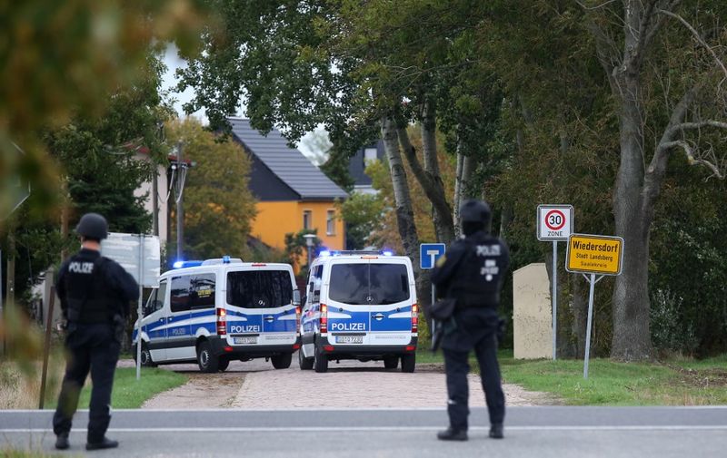 Police secures the area between Wiedersdorf and Landsberg near Halle, eastern Germany, where shots were fired on October 9, 2019. - At least two people were killed in a shooting on a street in the German city of Halle, police said, adding that the perpetrators were on the run. "Early indications show that two people were killed in Halle. Several shots were fired. The suspected perpetrators fled in a car," said police on Twitter, urging residents in the area to stay indoors. (Photo by Ronny Hartmann / AFP)