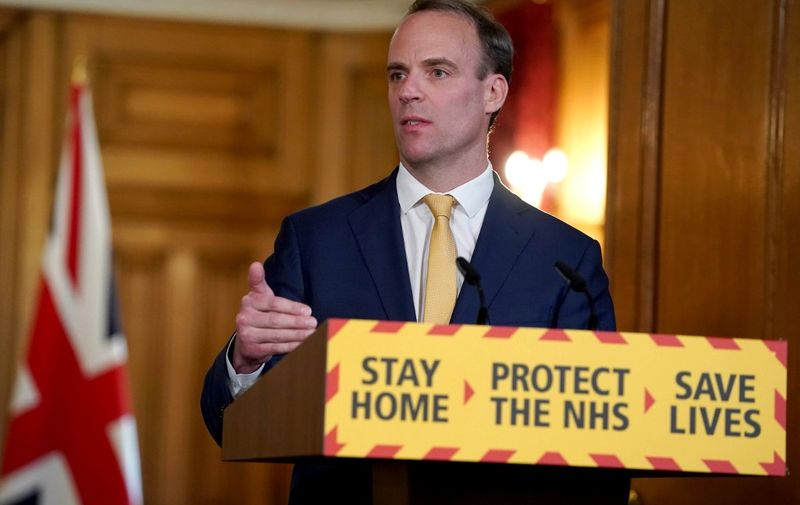 A handout image released by 10 Downing Street, shows Britain's Foreign Secretary Dominic Raab speaking during a remote press conference to update the nation on the COVID-19 pandemic, inside 10 Downing Street in central London on April 7, 2020. - Britain on Tuesday reported a record 786 new COVID-19 deaths in its daily update, following two days of falling figures. "As of 5pm on 6 April, of those hospitalised in the UK who tested positive for coronavirus, 6,159 have sadly died," the health ministry tweeted, up from 5,737 on Monday. (Photo by Pippa FOWLES / 10 Downing Street / AFP) / RESTRICTED TO EDITORIAL USE - MANDATORY CREDIT "AFP PHOTO / 10 DOWNING STREET / PIPPA FOWLES" - NO MARKETING - NO ADVERTISING CAMPAIGNS - DISTRIBUTED AS A SERVICE TO CLIENTS