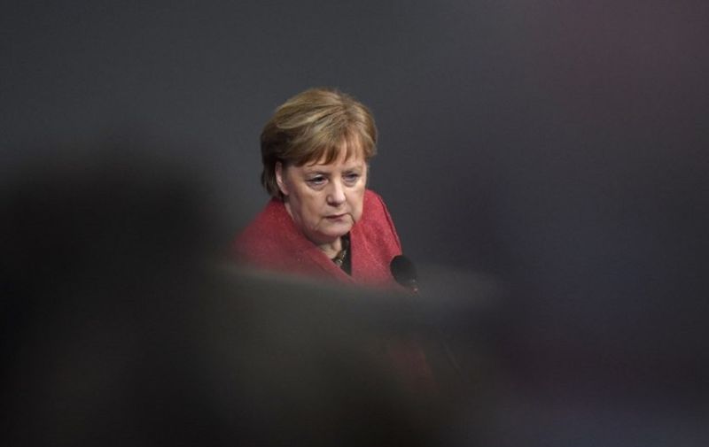 German Chancellor Angela Merkel answers questions during Question Time at the Bundestag (lower house of parliament) on eve of an EU summit, on December 12, 2018 in Berlin. (Photo by John MACDOUGALL / AFP)