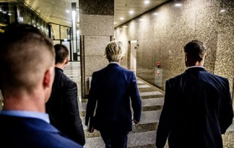 PVV leader Geert Wilders walks through a building lobby after election night in The Hague, on March 15, 2017. 
The Liberal party of Dutch Prime Minister Mark Rutte was set to win the most seats in Wednesday's elections, forcing far-right Geert Wilders into second place along with two other parties,  the Christian Democratic Appeal and the Democracy party D66, exit polls predicted. / AFP PHOTO / ANP / Robin Utrecht / Netherlands OUT - Belgium OUT