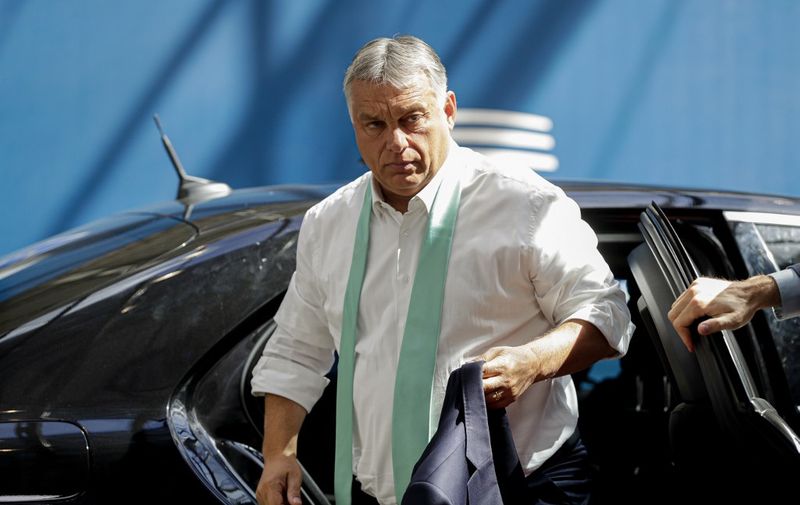 Hungary's Prime Minister Viktor Orban, arrives for the fourth day of an EU summit at the European Council building in Brussels, on July 20, 2020, as the leaders of the European Union hold their first face-to-face summit over a post-virus economic rescue plan. - The 27 EU leaders gather for another session of talks after three days and nights of prolonged wrangling failed to agree a 750-billion-euro ($860-billion) bundle of loans and grants to drag Europe out of the recession caused by the coronavirus pandemic (COVID-19). (Photo by STEPHANIE LECOCQ / POOL / AFP)