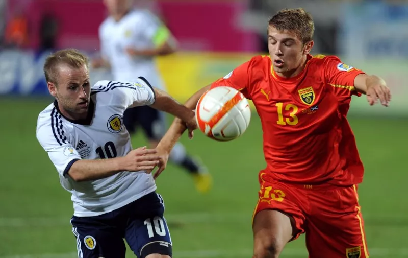 Macedonia's Stefan Ristovski (R) challenges Scotland's Barry Bannan (L) during the 2014 World Cup European zone group A qualifying football match between Scotland and F.Y.R. Macedonia at Filip II Stadium in Skopje on September 10, 2013. AFP PHOTO / ROBERT ATANASOVSKI