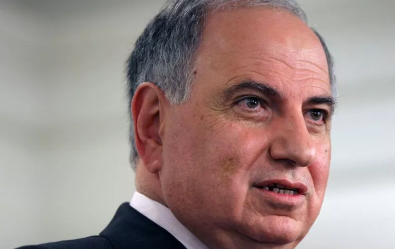 (FILES) - A file picture taken on December 30, 2005 shows then Iraqi prime minister Ahmed Chalabi delivering a speech at the American Enterprise Institute in Washington DC. Chalabi, who was blamed for providing false intelligence on weapons of mass destruction to justify the US led invasion of Iraq, died of a heart attack on November 3, 2015.   AFP PHOTO / NICHOLAS KAMM