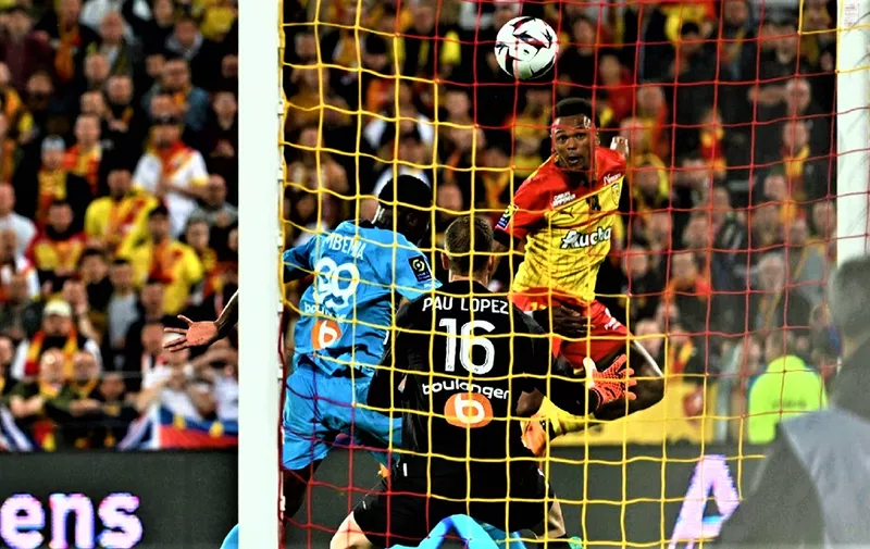 Lens' Belgian forward Lois Openda (R) scores his team's second goal during the French L1 football match between RC Lens and Olympique de Marseille (OM) at Stade Bollaert-Delelis in Lens, northern France on May 6, 2023. (Photo by DENIS CHARLET / AFP)