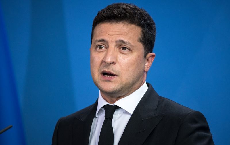Ukrainian President Volodymyr Zelensky and the German Chancellor (not in picture) give statements ahead of talks at the Chancellery in Berlin  on July 12, 2021. (Photo by STEFANIE LOOS / POOL / AFP)