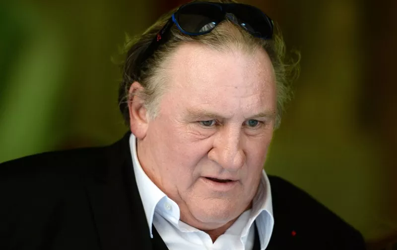 French-born actor Gerard Depardieu arrives at the city hall of Marseille, on September 1, 2015, as he takes part in the shooting of a TV movie in which he plays the mayor of Marseille.  AFP PHOTO / BORIS HORVAT / AFP / BORIS HORVAT