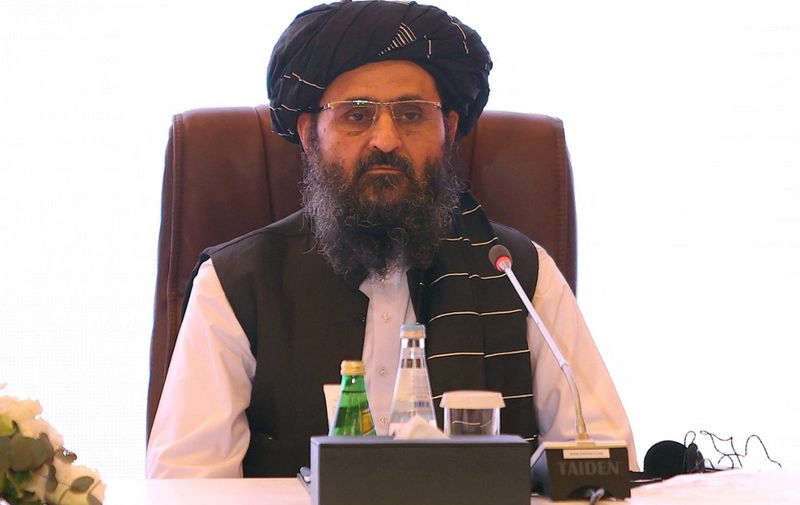 (FILES) In this file photo taken on July 18, 2021 the leader of the Taliban negotiating team Mullah Abdul Ghani Baradar looks on the final declaration of the peace talks between the Afghan government and the Taliban presented in Qatar's capital Doha. - US Central Intelligence Agency chief William Burns held a secret meeting in Kabul with Taliban co-founder Mullah Abdul Ghani Baradar, the Washington Post reported on August 24, 2021. The Monday meeting, which if confirmed will have been the highest-level encounter between the Islamist group and the Biden administration since the militants' return to power, came as efforts to evacuate thousands of people from Taliban-controlled Afghanistan became increasingly urgent. (Photo by KARIM JAAFAR / AFP)