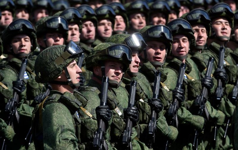 Russian soldiers march through Red Square during the Victory Day military parade in Moscow on May 9, 2015. Russian President Vladimir Putin presides over a huge Victory Day parade celebrating the 70th anniversary of the Soviet win over Nazi Germany, amid a Western boycott of the festivities over the Ukraine crisis. AFP PHOTO / KIRILL KUDRYAVTSEV