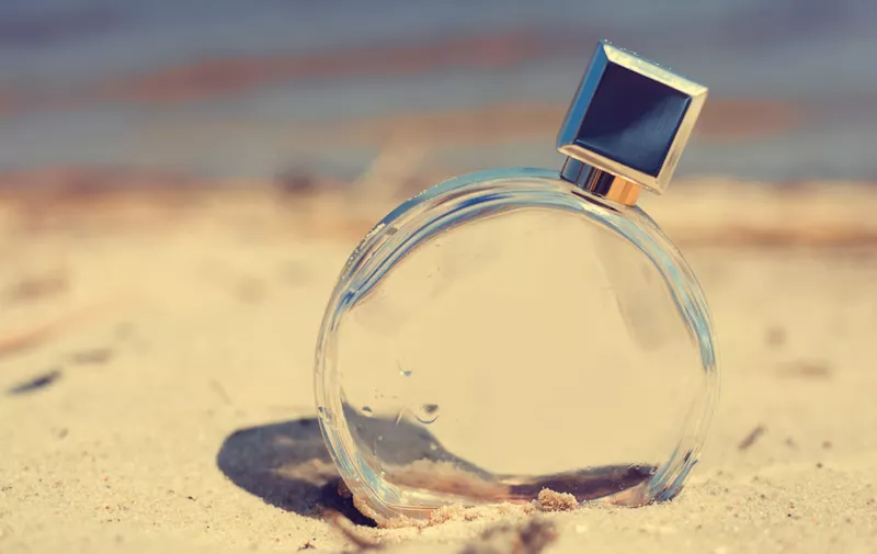 Women's perfume on the beach