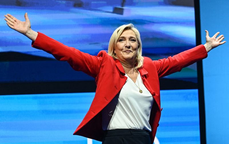 French far-right party Rassemblement National (RN) presidential candidate Marine Le Pen arrives to deliver a speech at a gathering with supporters as part of a campaign visit in Avignon on April 14, 2022. (Photo by CHRISTOPHE SIMON / AFP)
