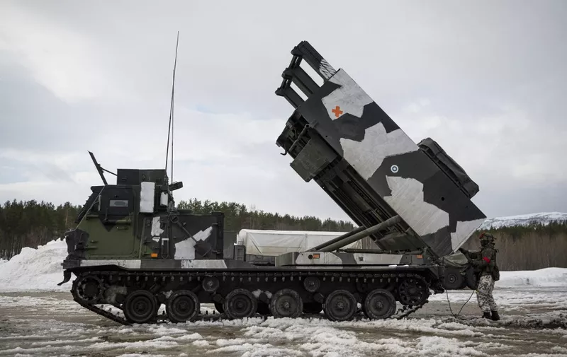 The M270 Multiple Launch Rocket System, operated by the Finnish Defence Forces, is pictured during the international military exercise Cold Response 22, at Setermoen, North of in Norway, on March 22, 2022. - Cold Response is a Norwegian-led winter exercise in which involving 30,000 NATO troops and partner countries and was planned long before Moscow's invasion of Ukraine. (Photo by Jonathan NACKSTRAND / AFP)