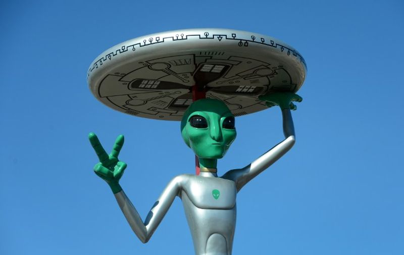 A structure of a gesturing Alien in a parking lot in Baker, California on May 10, 2015, of a business selling Beef Jerky and other Jerky products. Besides Aliens, the town of Baker, on the road between Los Angeles and Las Vegas, is known as home to the world's largest thermometer, built in 1991 to honor the highest temperature ever recorded, which was 134 degrees in Death Valley National Park, north of Baker. AFP PHOTO / FREDERIC J. BROWN / AFP PHOTO / FREDERIC J. BROWN