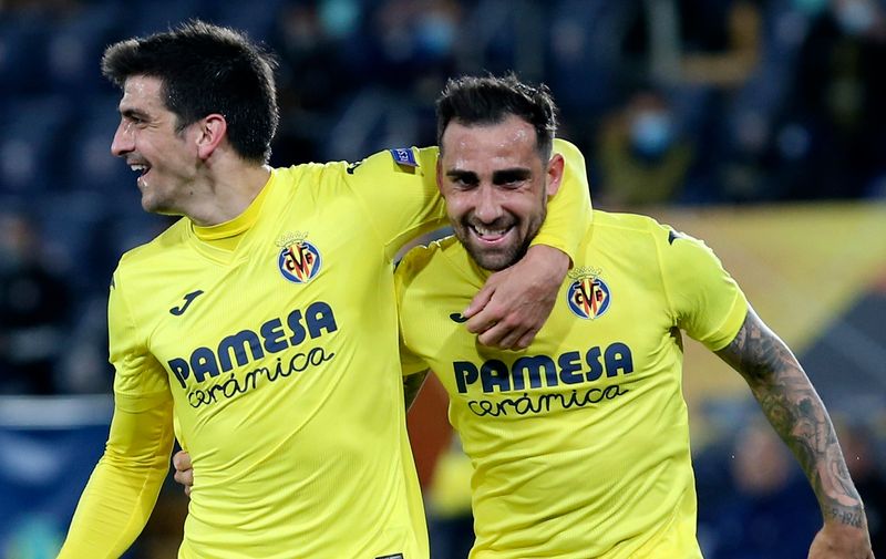 Villareal's Paco Alcacer, right, celebrates with Villareal's Gerard Moreno after scoring his side's opening goal during the Europa League quarter final second leg soccer match between Villarreal and Dinamo Zagreb, at the Ceramica stadium in Villarreal, Spain, Thursday, April 15, 2021. (AP Photo/Alberto Saiz)