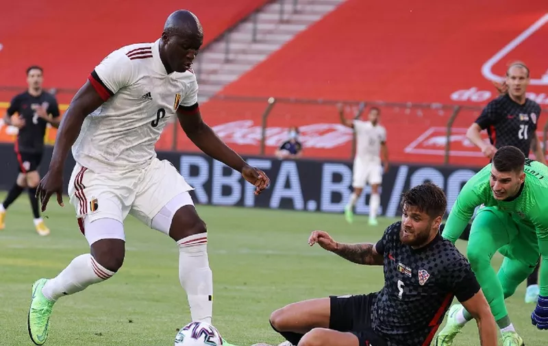 Belgium's forward Romelu Lukaku controls the ball (L) during the international friendly football match between Belgium and Croatia at the King Baudouin Stadium in Brussels on June 6, 2021, ahead of the EURO 2020/2021 tournament. (Photo by Kenzo TRIBOUILLARD / AFP)
