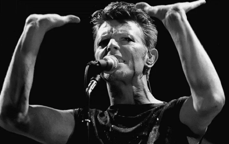 (FILES) A photo taken in May 1983 shows British rock music legend David Bowie performing on stage during a concert at the Festhalle in Frankfurt am Main, western Germany. 

Bowie has died after a long battle with cancer, his official Twitter and Facebook accounts said on January 11, 2016. The iconic musician had turned 69 only on January 8, which coincided with the release of "Blackstar", his 25th studio album. / AFP / DPA / Katja Lenz / Germany OUT