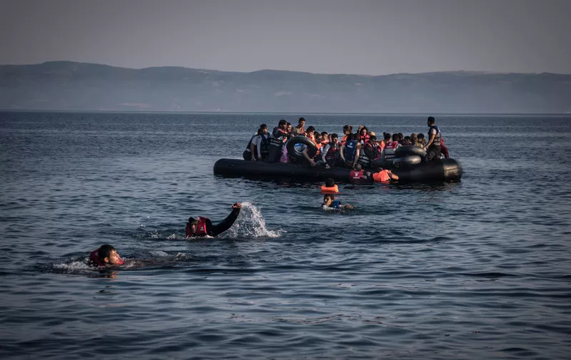People swim to shore after the engine of their inflatable boat ran out of fuel upon arrival in Lesbos, Greece, July, 27, 2015. Migrants and refugees, arriving in numbers reflecting a full-scale humanitarian crisis, land on the island at all hours after traveling in boats that should hold 15 but usually carry 40 or more., Image: 254744648, License: Rights-managed, Restrictions: , Model Release: no, Credit line: Profimedia, New York Times