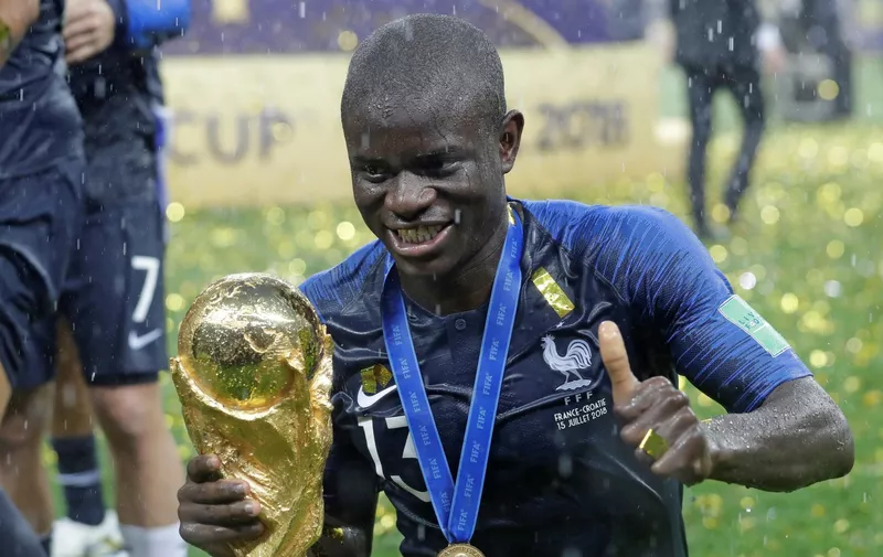 France's Ngolo Kante celebrates with the trophy after the final match between France and Croatia at the 2018 soccer World Cup in the Luzhniki Stadium in Moscow, Russia, Sunday, July 15, 2018. France won the final 4-2. (AP Photo/Matthias Schrader)