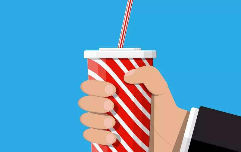 Red striped paper glass with drinking straw in hand. Disposable cup for beverages. Fast food. Vector illustration in flat style (Red striped paper glass with drinking straw in hand. Disposable cup for beverages. Fast food. Vector illustration in flat