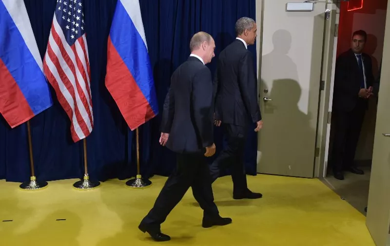 US President Barack Obama and Russia's President Vladimir Putin leave after posing for a photo ahead of a bilateral meeting on the sidelines of the 70th session of the UN General Assembly at the United Nations headquarters on September 28, 2015 in New York. AFP PHOTO/MANDEL NGAN