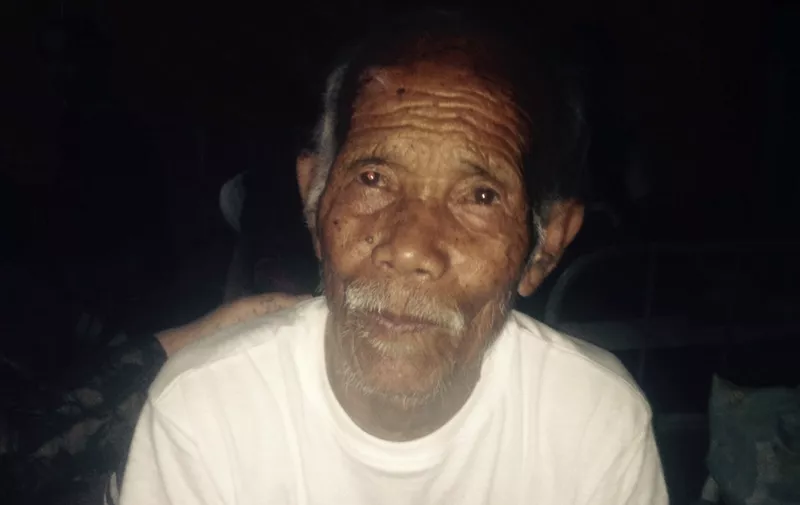 Funchu Tamang, 101, sits on a bed in a hospital in Nuwakot district on May 3, 2015 around 80 kilometres (50 miles) northwest of Kathmandu where he was taken after being rescued from his collapsed home a day earlier.  Rescuers have pulled a 101-year-old man alive from his ruined home a week after Nepal's earthquake claimed at least 7,200 lives, as the government warned Sunday the death toll will climb "much higher".      AFP PHOTOSTR/AFP/Getty Images