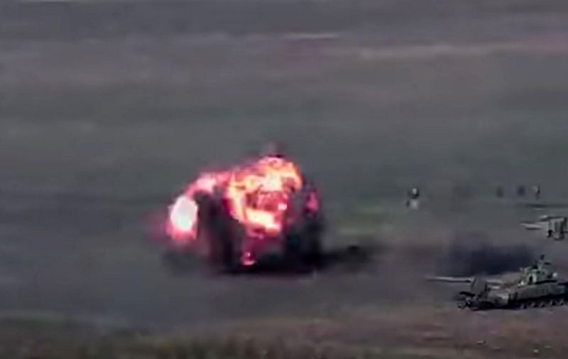 An image grab taken from a video made available on the official web site of the Armenian Defence Ministry on September 27, 2020, allegedly shows destroying of Azeri tanks and servicemen during clashes between Armenian separatists and Azerbaijan. (Photo by Handout / Armenian Defence Ministry / AFP) / RESTRICTED TO EDITORIAL USE - MANDATORY CREDIT "AFP PHOTO / Armenian Defence Ministry" - NO MARKETING NO ADVERTISING CAMPAIGNS - DISTRIBUTED AS A SERVICE TO CLIENTS --- NO ARCHIVE ---