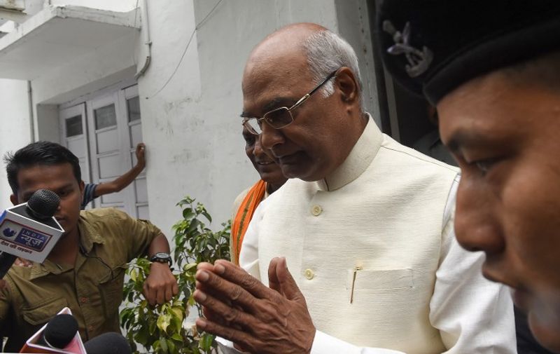 Bihar Governor Ram Nath Kovind (C) gestures as he leaves his residence in New Delhi on June 20, 2017.
Bharatiya Janata Party proposed the name of Bihar Governor Ram Nath Kovind as the National Democratic Alliance (NDA) governments's candidate for the upcoming Presidential election. Seventy-one-year-old Kovind is a Dalit leader from Kanpur. / AFP PHOTO / Prakash SINGH