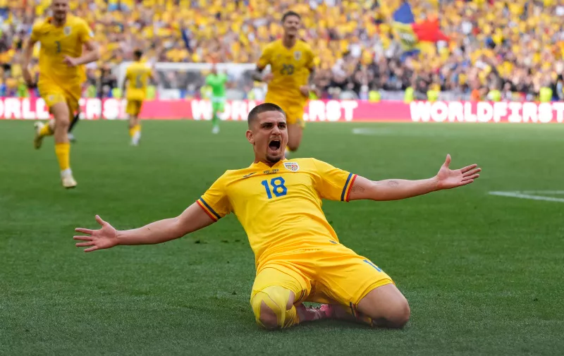 Romania's Razvan Marin celebrates scoring his side's 2nd goal during a Group E match between Romania and Ukraine at the Euro 2024 soccer tournament in Munich, Germany, Monday, June 17, 2024. (AP Photo/Antonio Calanni)
