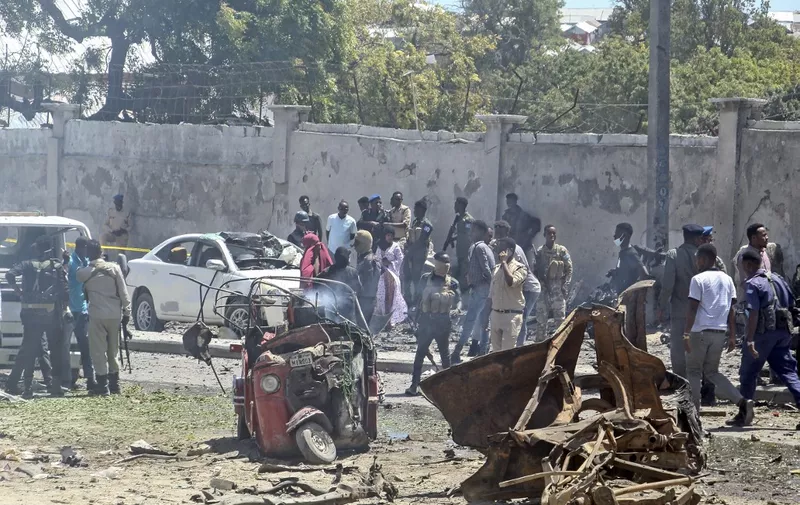A general view of the scene of a car-bomb explosion in Mogadishu on January 12, 2022 where at least six people were killed and several others wounded in the huge blast that caused devastation in the area along the 21st October road. - At least six people were killed and undisclosed number of others wounded after a huge car bomb explosion rocked along a road in southern Mogadishu causing casualties and devastation. (Photo by AFP)