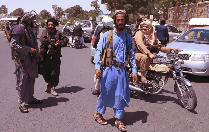 Taliban fighters patrol the streets in Herat on August 14, 2021. (Photo by - / AFP)
