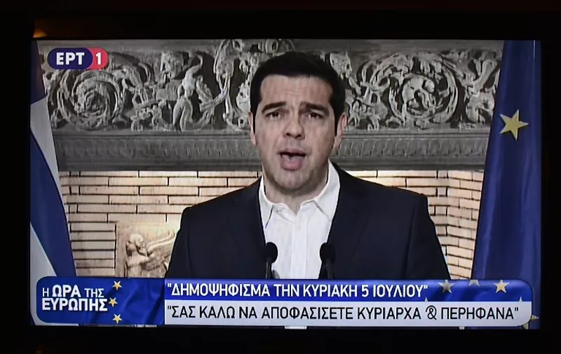 In a picture of a television of a national TV grab shows Greek prime minister Alexis Tsipras during his televised address to the Greek nation from Athens early on June 27, 2015 , announcing a referendum for next Sunday, July 5th.    Greek Prime Minister Alexis Tsipras said he would call a referendum on the outcome of the negotiations with international creditors on Greece's bailout taking place in Brussels later in the day. AFP PHOTO/ LOUISA GOULIAMAKI