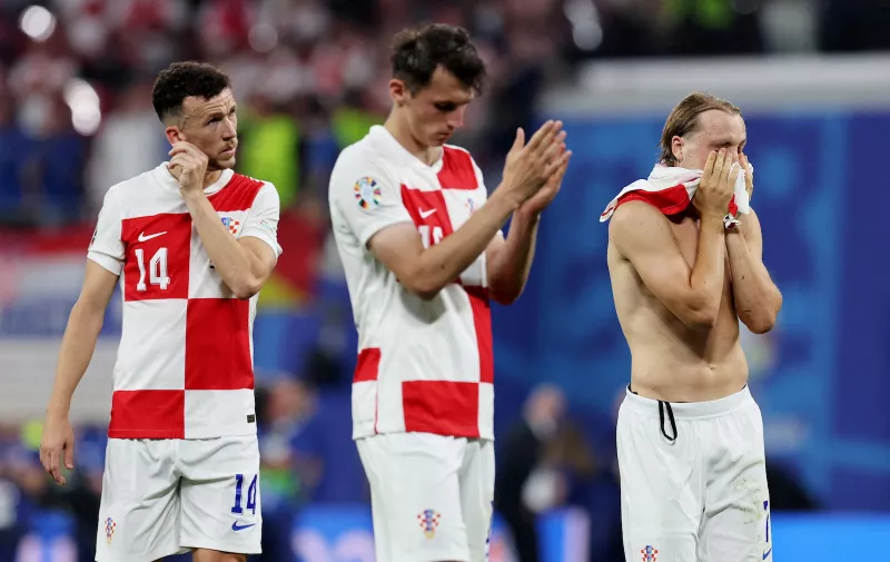 Soccer Football - Euro 2024 - Group B - Croatia v Italy - Leipzig Stadium, Leipzig, Germany - June 24, 2024 
Croatia's Ivan Perisic and Lovro Majer look dejected after the match REUTERS/Karina Hessland     TPX IMAGES OF THE DAY