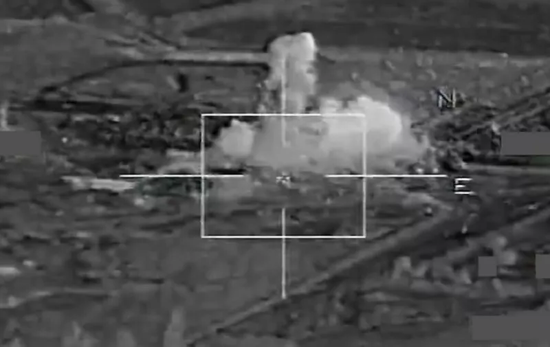 A grab image taken from a handout video released on November 17, 2015 by French Defense Audiovisual Communication and Production Unit (ECPAD) shows French warplanes bombing operational sites at the Islamic State's Syria stronghold Raqa. French warplanes targeted the Islamic State's Syria stronghold for the third consecutive day today, hitting jihadists who claimed responsibility for the Paris attacks, Defence Minister Jean Yves Le Drian said.  AFP PHOTO / ECPAD / EMA 
= RESTRICTED TO EDITORIAL USE - MANDATORY CREDIT "AFP PHOTO / ECPAD / EMA " - NO MARKETING NO ADVERTISING CAMPAIGNS - DISTRIBUTED AS A SERVICE TO CLIENTS - TO BE USED WITHIN 30 DAYS FROM 17/11/2015== / AFP / ECPAD / EMA / -