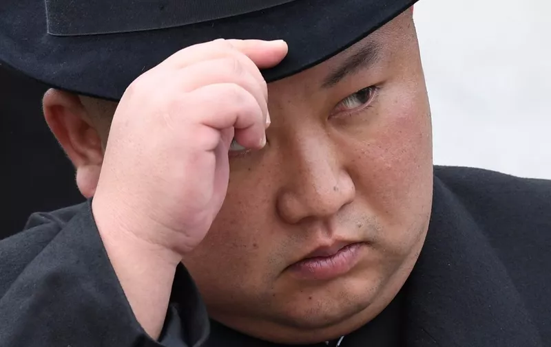 (FILES) In this file photo North Korean leader Kim Jong Un attends a wreath-laying ceremony at a WWII memorial in the far-eastern Russian port of Vladivostok on April 26, 2019. - North Korean leader Kim Jong Un has made his first public appearance since speculation about his health began last month, cutting the ribbon at the opening of a fertilizer factory, KCNA reported on May2. (Photo by Kirill KUDRYAVTSEV / AFP)