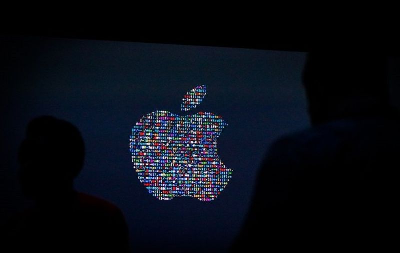 (FILES) This file photo taken on June 13, 2016 shows the Apple logo displayed on a screen at Apple's annual Worldwide Developers Conference presentation at the Bill Graham Civic Auditorium in San Francisco, California.
Apple on August 29, 2016 sent out invitations to a "special event" on September 7 in San Francisco, where it is expected to unveil a new iPhone model. In the company's usual enigmatic style, it provided little more that the date, time and place to the invitation-only gathering set for the Bill Graham Civic Auditorium near San Francisco City Hall.
 / AFP PHOTO / GABRIELLE LURIE