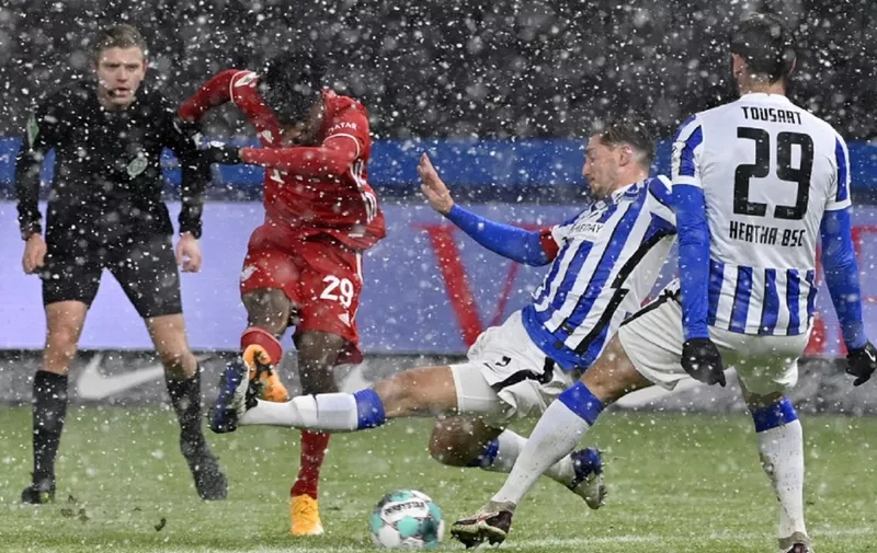 Bayern Munich's French forward Kingsley Coman scores during the German first division Bundesliga football match between Hertha BSC Berlin and FC Bayern Munich in Berlin on February 5, 2021. (Photo by John MACDOUGALL / POOL / AFP) / DFL REGULATIONS PROHIBIT ANY USE OF PHOTOGRAPHS AS IMAGE SEQUENCES AND/OR QUASI-VIDEO