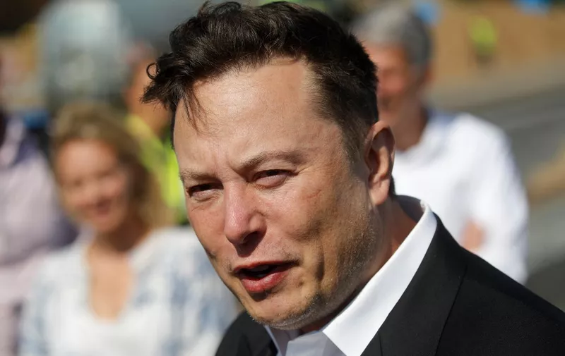 (FILES) In this file photo taken on September 3, 2020, Tesla CEO Elon Musk talks to media as he arrives to visit the construction site of the future US electric car giant Tesla, in Gruenheide near Berlin. - Elon Musk took control of Twitter and fired its top executives, US media reported late October 27, 2022, hours before the deadline for the billionaire to seal his on-again, off-again deal to purchase the social media network. (Photo by Odd ANDERSEN / AFP)