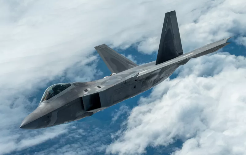 U.S. Air Force Maj. Paul Lopez, F-22 Demo Team commander, flies next to a KC-135 Stratotanker during an aerial refueling mission over Spokane, Washington, June 20, 2019. Representing the U.S. Air Force and Air Combat Command, the F-22 Demo Team travels to 25 air shows a season to showcase the performance and capabilities of the world's premier 5th-generation fighter. (U.S. Air Force photo by 2nd Lt. Samuel Eckholm)