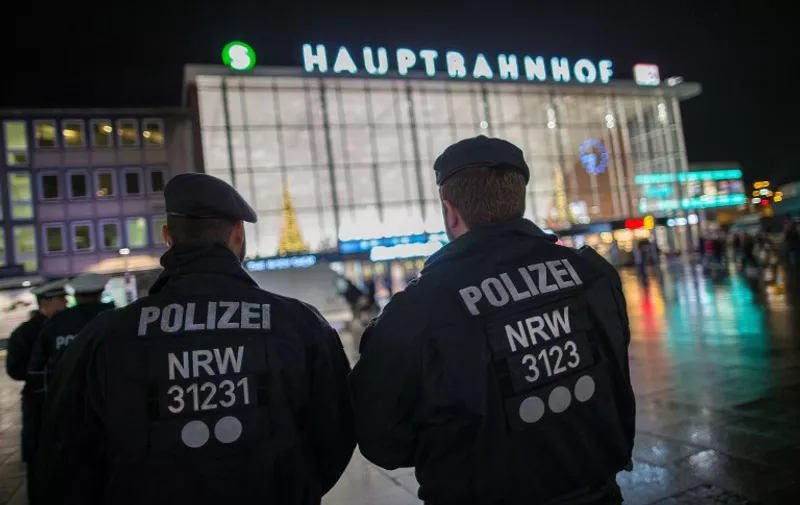 Police officers standing outside the main station in Cologne, Germany, 6 January 2016. After sexual assaults on women at New Year, there is an increased police presence at the main station. PHOTO: MAJA HITIJ/DPA